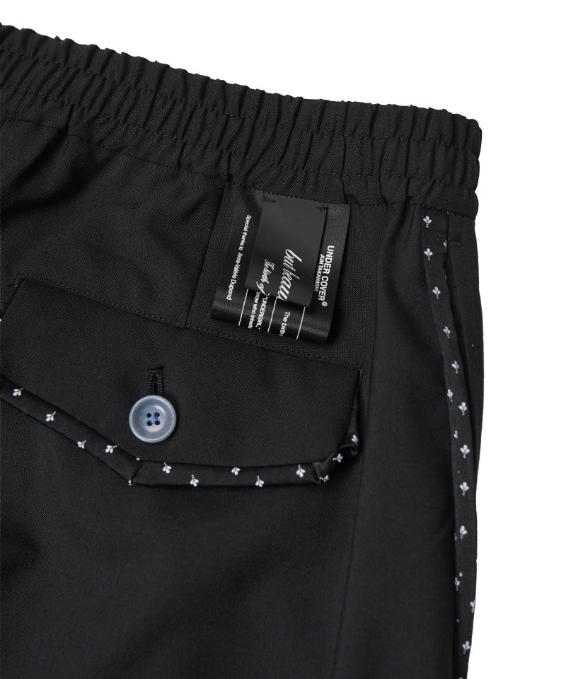 UNDERCOVER＞CORDURAウールトロカーブ側章1タックワイドスラックス